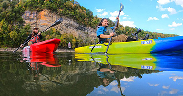 happy couple paddling in jackson kayak staxx kayaks