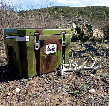 orion cooler in the high desert with an antler in front of it