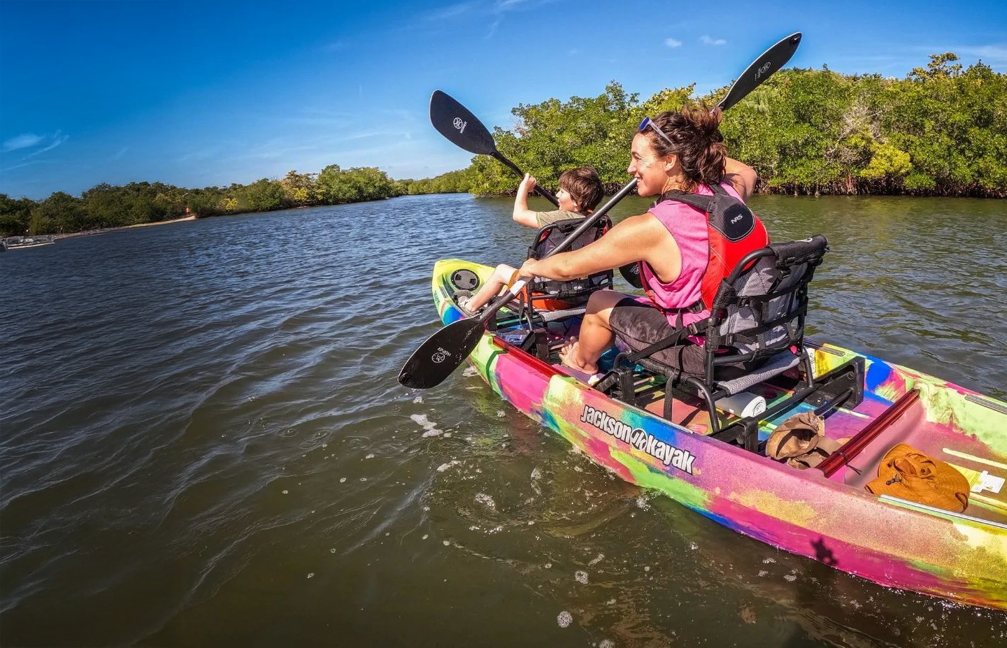 happy mother paddling with her son in the tandem jackson kayak taketwo