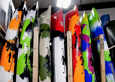 fishing kayaks  lined up at a dealer