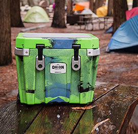 A Orion Cooler sitting on a porch.