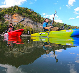 happy couple paddling in jackson kayak staxx kayaks