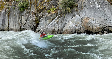 Picture of a person kayaking in whitewater for mobile screens.